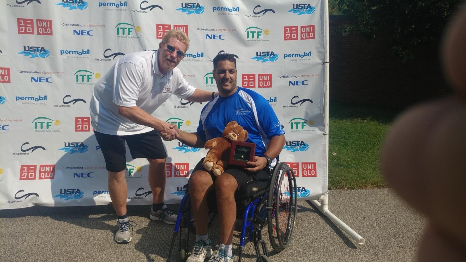 Official ITF Podium & Director Handshake